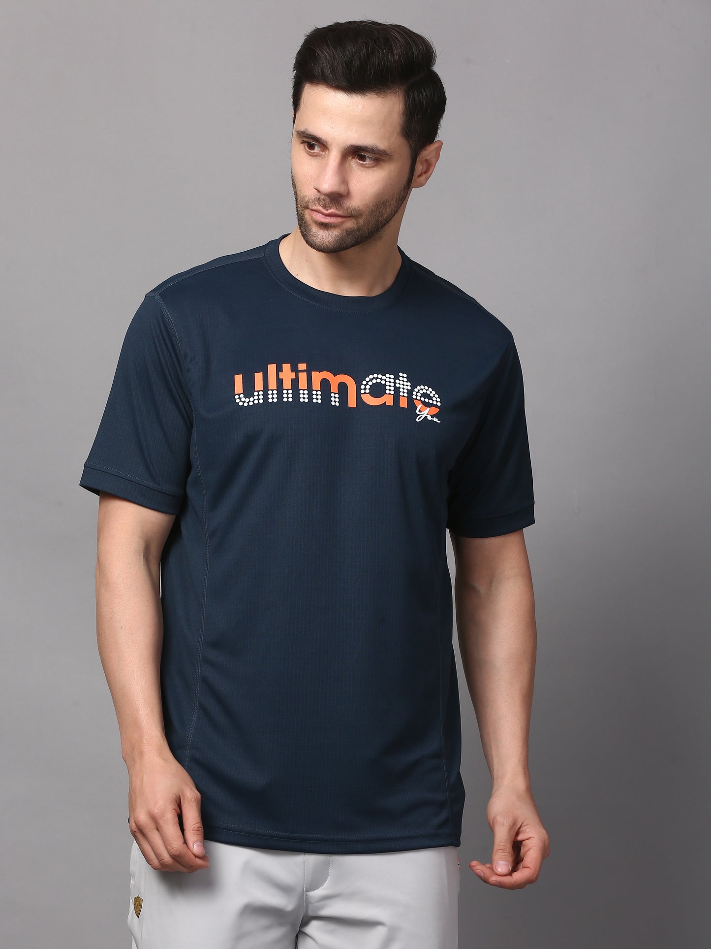 A navy round neck T-shirt with the brand name 'ultimate' printed on the front.