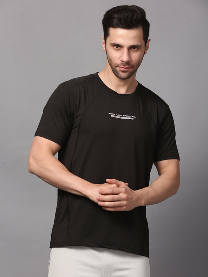 This image features a sleek, men's round neck black T-shirt. The T-shirt is designed with a minimalist approach, showcasing a small, white graphic on the upper left chest area.